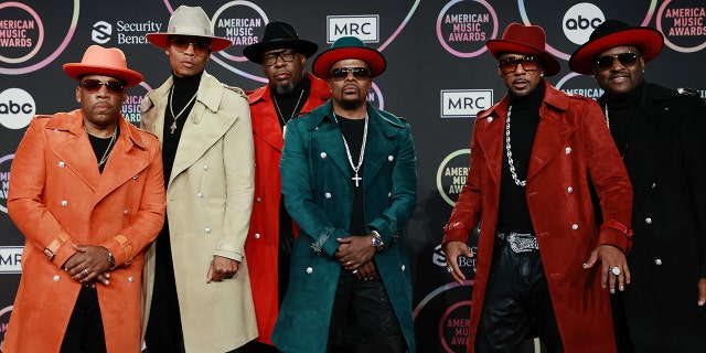 Members of New Edition, from left, Michael Bivins, Ronnie DeVoe, Bobby Brown, Ricky Bell, Ralph Tresvant and Johnny Gill pose at the 2021 American Music Awards on Nov. 21, 2021, in Los Angeles, California.