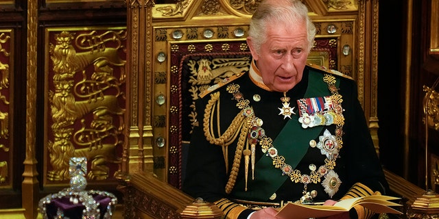 Prince Charles reads the Queen's Speech next to her Imperial State Crown in the House of Lords Chamber at the Palace of Westminster on May 10, 2022, in London.