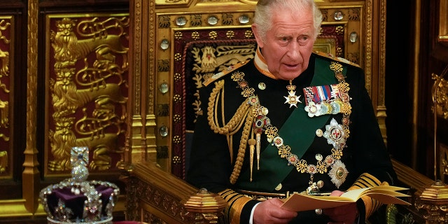 Prince Charles reads the Queen's Speech next to her Imperial State Crown in the House of Lords Chamber at the Palace of Westminster on May 10, 2022, in London.