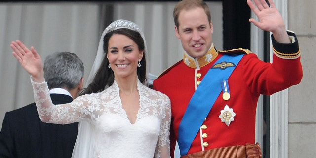 Catherine, Duchess of Cambridge and Prince William, Duke of Cambridge greet well-wishers from the balcony at Buckingham Palace on April 29, 2011, in London.