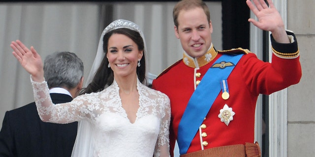 Catherine, Duchess of Cambridge and Prince William, Duke of Cambridge greet well-wishers from the balcony at Buckingham Palace on April 29, 2011, in London. 