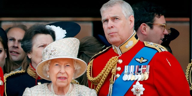 Queen Elizabeth II and Prince Andrew, Duke of York watch a flypast from the balcony of Buckingham Palace during Trooping The Colour in 2019. Andrew has largely stayed out of the public since his alleged involvement in a sex abuse scandal.