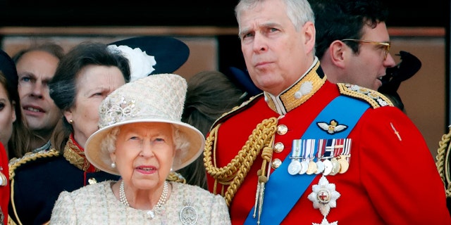 Queen Elizabeth II and Prince Andrew, Duke of York watch a flypast from the balcony of Buckingham Palace during Trooping The Colour, the Queen's annual birthday parade, on June 8, 2019 in London, England. He will not be present on the royal balcony at the Platinum Jubilee celebrations.