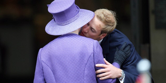 Prince William, seen here greeting his grandmother Queen Elizabeth, is second in line to the throne.