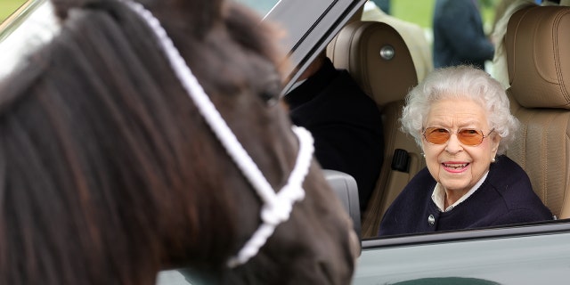 Queen Elizabeth II watches the horses from her Range Rover at The Royal Windsor Horse Show at Home Park May 13, 2022, in Windsor, England.
