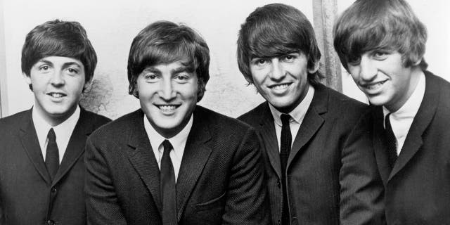 Rock and roll band "The Beatles" pose for a portrait in 1962.