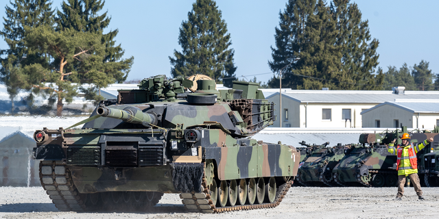 A U.S. Army tank is marshaled on the grounds of the Grafenwoehr military training area on March 11.