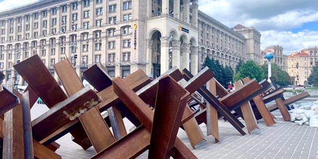 Steel barriers line the sidewalk in central Kyiv.