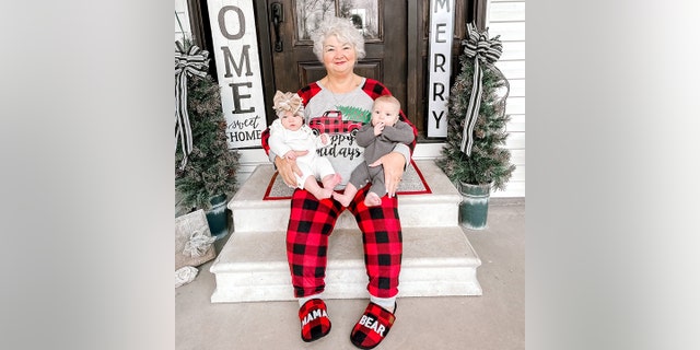 Tracy Cheatham of Central Florida is seen with her twin grandchildren, Landrie and Rollyn, during the 2021 holiday season.