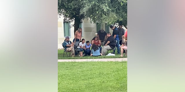 Parents wait to be reunited with their children at the Uvalde Civic Center in Uvalde, Texas, on Tuesday, May 24, 2022.