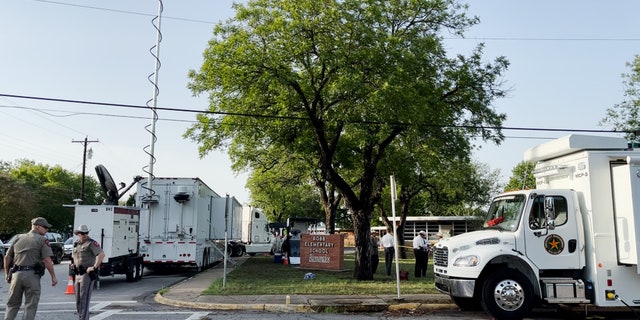 Law enforcement surround Robb Elementary School in Uvalde, Texas, on Wednesday morning.