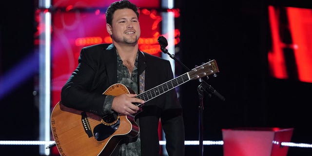 Ian Flanigan is shown performing on stage during an appearance on "The voice." "I always had the support of my hometown," he told Fox News Digital.