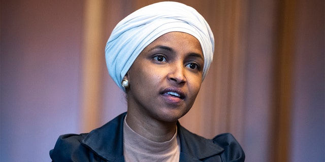 Rep. Ilhan Omar, D-Minn., is seen in the US Capitols Rayburn Room during a group photo with the Congressional Black Caucus, on Wednesday, April 6, 2022. 