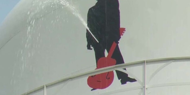 Timothy Sled shot the silhouette of Johnny Cash on Kingsland water tank causing it to leak.