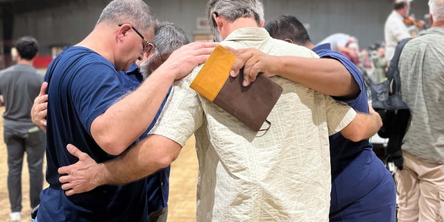 Community in Uvalde, Texas gather together to pray for the victims at Robb Elementary School.