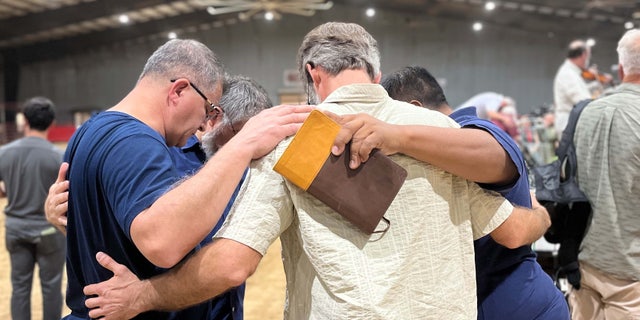 Community in Uvalde, Texas gather together to pray for the victims at Robb Elementary School.