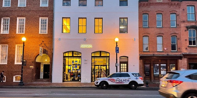 An MPD vehicle sits outside a store in D.C.'s Georgetown neighborhood the day after a shooting.