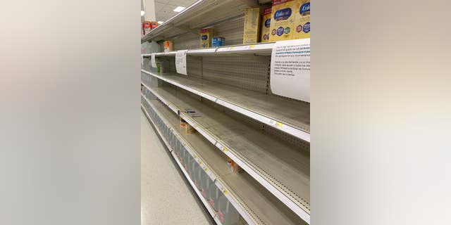 Signs at a local Target inform shoppers that they are limited to 4 containers each due to the shortage in baby formula.
