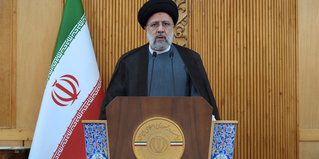 Iranian President Ebrahim Raisi speaks before departing Tehran's Mehrabad airport for a trip to Oman, Monday, May, 23, 2022. (AP Photo/Vahid Salemi)