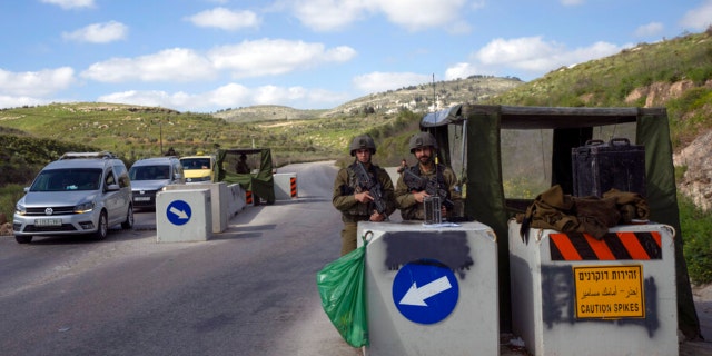 An Israeli army checkpoint controls the street leading to the West Bank city of Jenin April 12, 2022.