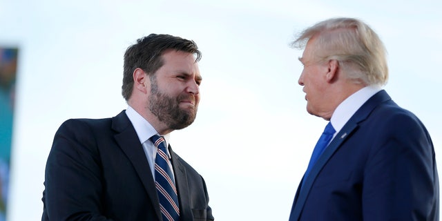 Senate candidate JD Vance, left, greets former President Donald Trump at a rally at the Delaware County Fairgrounds, Saturday, April 23, 2022, in Delaware, Ohio, to endorse Republican candidates ahead of the Ohio primary on May 3. On Tuesday voters in Ohio choose between the Trump-backed JD Vance for an open U.S. Senate seat and several other contenders who spent months clamoring for the former president's support. (AP Photo/Joe Maiorana, File)