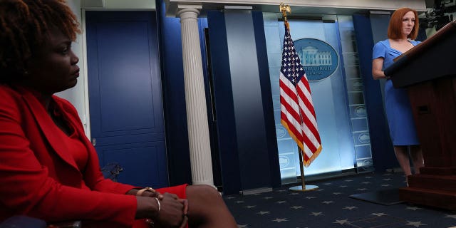 Press secretary Jen Psaki holds a press briefing as her replacement, Karine Jean-Pierre, watches at the White House, May 12, 2022.