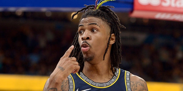 Memphis Grizzlies guard Ja Morant reacts after scoring during the second half of Game 2 of the team's second-round NBA basketball playoff series against the Golden State Warriors on Tuesday, May 3, 2022, in Memphis, Tenn. The Grizzlies won 106-101.