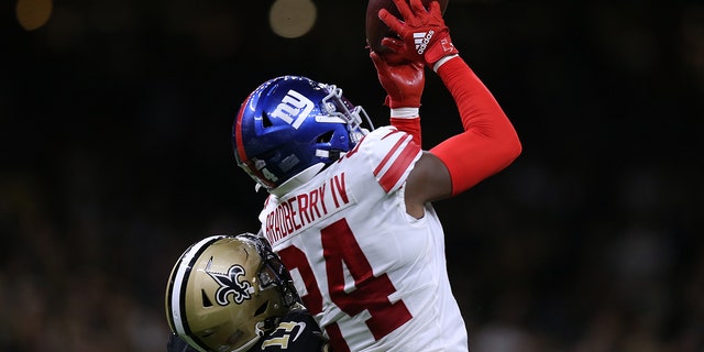 James Bradberry, number 24 of the New York Giants, intercepts the ball intended for Deonte Harris, number 11 of the New Orleans Saints, during a game at Caesars Superdome on October 3, 2021 in New Orleans, Louisiana.
