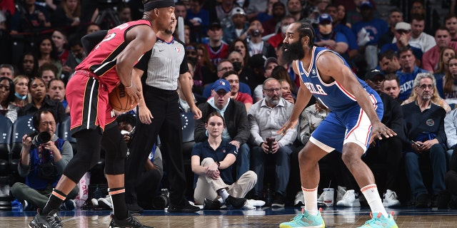 James Harden #1 of the Philadelphia 76ers plays defense on Jimmy Butler #22 of the Miami Heat during Game 6 of the 2022 NBA Playoffs Eastern Conference Semifinals on May 12, 2022 at the Wells Fargo Center in Philadelphia, Pennsylvania.