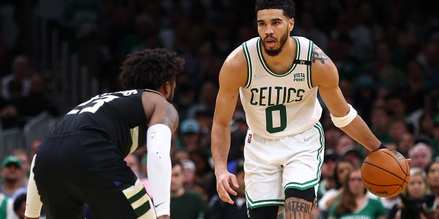 Jayson Tatum #0 of the Boston Celtics dribbles against Wesley Matthews #23 of the Milwaukee Bucks during the second quarter of Game Seven of the 2022 NBA Playoffs Eastern Conference Semifinals at TD Garden on May 15, 2022 in Boston, Mass.