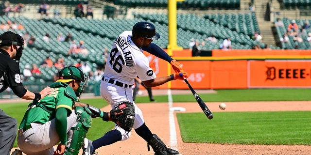Detroit Tigers third baseman Jeimer Candelario (46) lines a single to right field in the ninth inning during a game between the Detroit Tigers and Oakland A's May 10, 2022, at Comerica Park in Detroit, Mich.