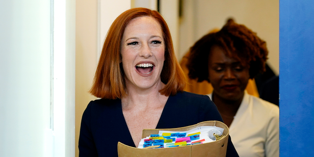 White House press secretary Jen Psaki smiles as she enters one of her final briefings, before stepping down from her role.