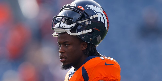 Jerry Jeudy with helmet on head