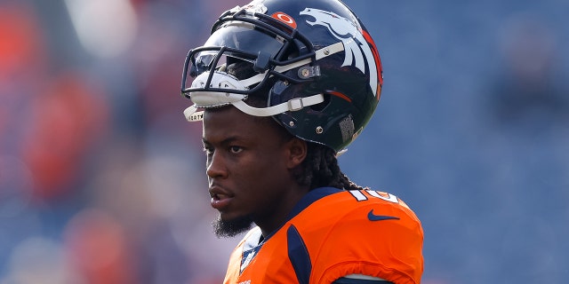 Jerry Jeudy with helmet on head