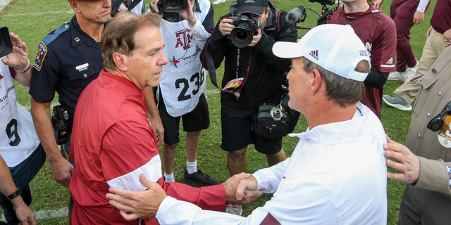 12 October 2019; College Station, TX, USA; Alabama Crimson Tide head coach Nick Saban and Texas A&M Aggies head coach Jimbo Fisher shake hands as the match ends at Kyle Field. 