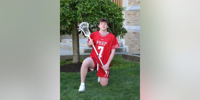 James McGrath poses in his lacrosse uniform.