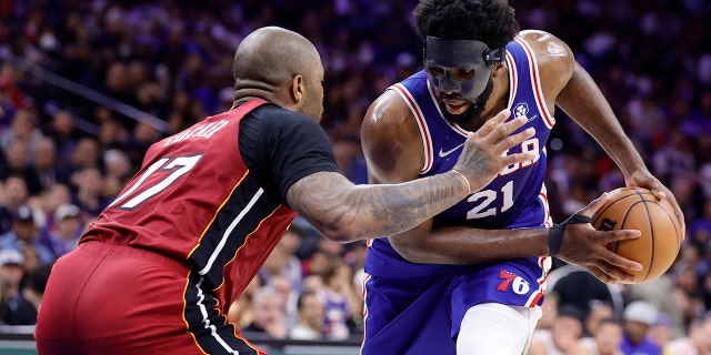 Joel Embiid #21 of the Philadelphia 76ers controls the ball against P.J. Tucker #17 of the Miami Heat in Game Six of the 2022 NBA Playoffs Eastern Conference Semifinals at Wells Fargo Center on May 12, 2022 in Philadelphia, Pennsylvania.