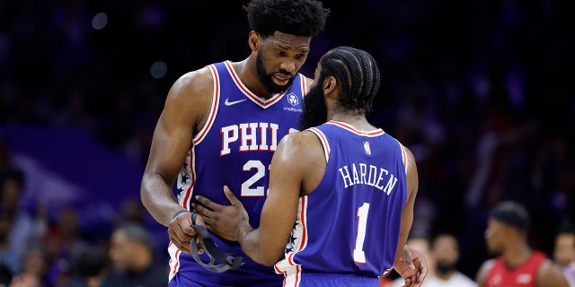 Joel Embiid speaks with James Harden