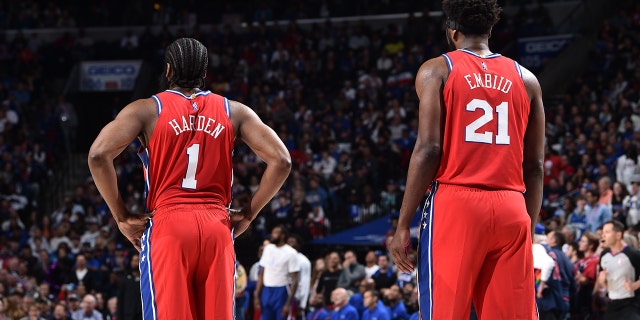 James Harden #1 and Joel Embiid #21 of the Philadelphia 76ers look on against the Miami Heat on May 8, 2022 at the Wells Fargo Center in Philadelphia, Pennsylvania.