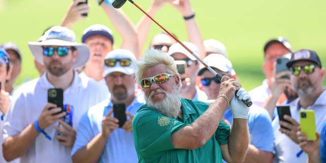 John Daly of The United States plays his second shot on the 16th hole during the first round of the 2022 PGA Championship at Southern Hills Country Club on May 19, 2022 in Tulsa, Oklahoma.