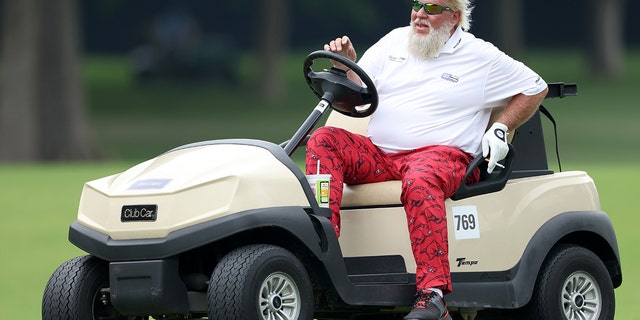 John Daly of the U.S. drives his cart to the 17th hole during the second round of the 2022 PGA Championship at Southern Hills Country Club May 20, 2022, in Tulsa, Okla.