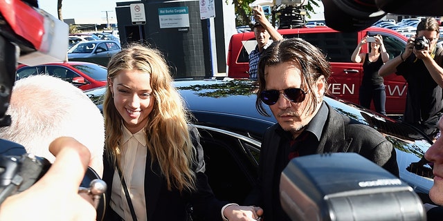 Johnny Depp and Amber Heard arrive at Southport Magistrates Court on April 18, 2016, in Gold Coast, Australia. Heard had faced two counts of breaching Australia's quarantine laws by allegedly bringing in her pet dogs Pistol and Boo on a private jet in May 2015.