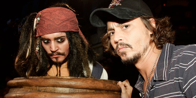 Johnny Depp comes face to face with Captain Jack Sparrow at the "Pirates of the Caribbean" ride at Disneyland in Anaheim, Calif.