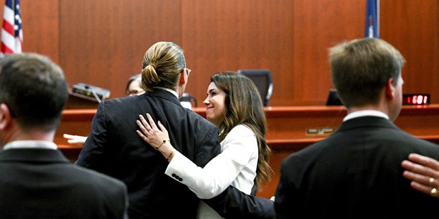 Johnny Depp and attorney Camille Vasquez embrace in court May 17, 2022, setting off romance rumors.