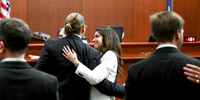 Johnny Depp and attorney Camille Vasquez embrace in court May 17, 2022, setting off romance rumors.