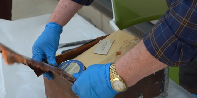 The time capsule was opened after being found inside an old courthouse building in Johnson County, Kan.