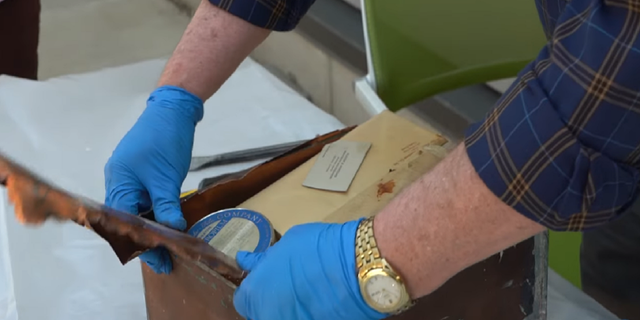 The time capsule was opened after being found inside an old courthouse building in Johnson County, Kan.
