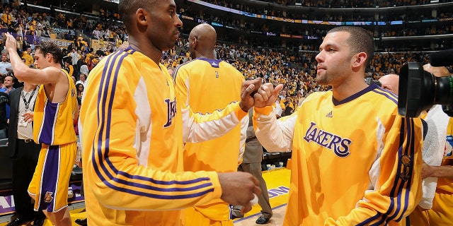 Kobe Bryant of the Lakers celebrates with Jordan Farmar during the 2009 NBA Finals against the Orlando Magic at Staples Center on June 4, 2009, in Los Angeles.