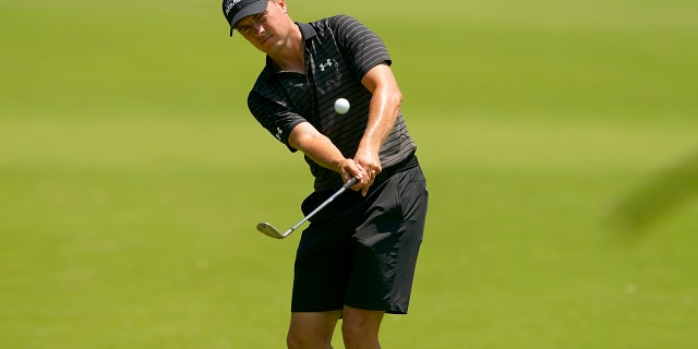 Jordan Spieth reaches the green during a free practice round for the PGA championship golf tournament, Wednesday, May 18, 2022, in Tulsa, Oklahoma.