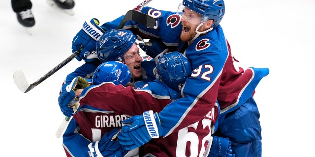 Colorado Avalanche defenseman Josh Manson is congratulated by teammates after scoring in overtime against the St. Louis Blues in Game 1 of the second-round playoff series Tuesday, May 17, 2022, in Denver.